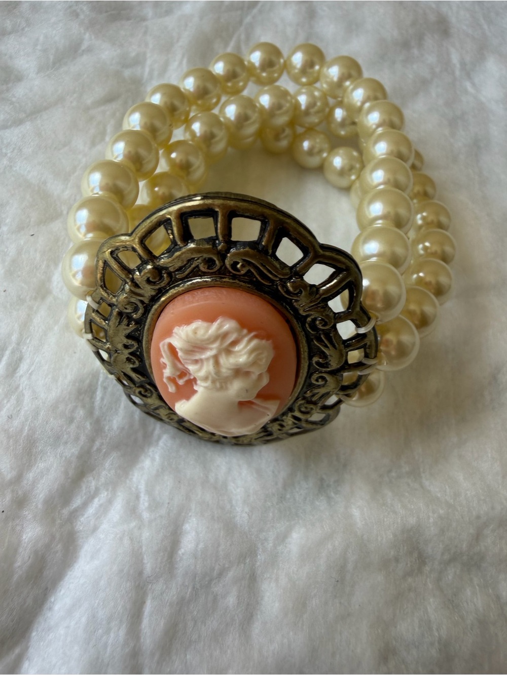 Orange coral color cameo triple strand iridescent faux pearl stretch bracelet